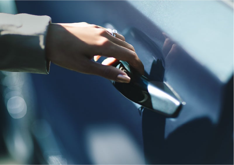 A hand gracefully grips the Light Touch Handle of a 2023 Lincoln Aviator® SUV to demonstrate its ease of use | Thornhill Lincoln in Chapmanville WV