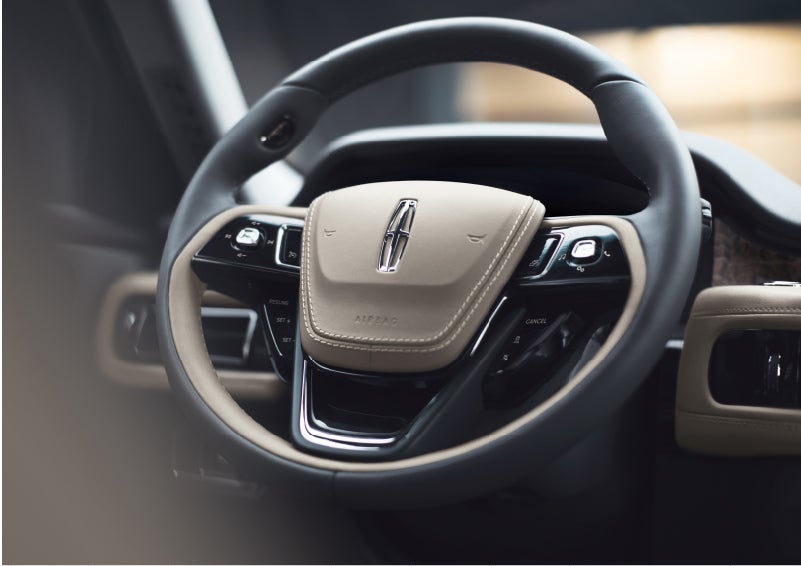 The intuitively placed controls of the steering wheel on a 2023 Lincoln Aviator® SUV | Thornhill Lincoln in Chapmanville WV