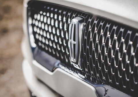The grille of the 2024 Lincoln Aviator® Reserve model with an eye-catching repeated field of Lincoln Star logo shapes | Thornhill Lincoln in Chapmanville WV