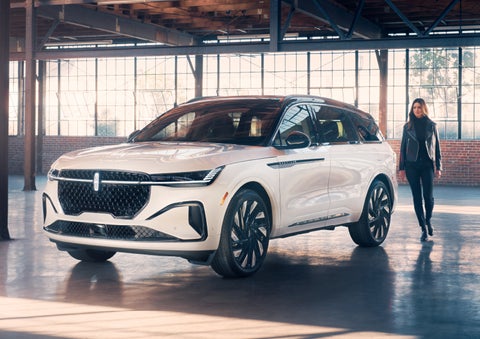 A person approaches a 2024 Lincoln Nautilus® SUV. | Thornhill Lincoln in Chapmanville WV