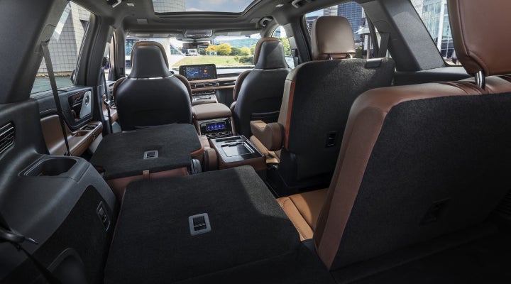 One side of the PowerFold® third-row seat and a second-row seat are folded forward in the 2026 Lincoln Aviator® SUV. | Thornhill Lincoln in Chapmanville WV