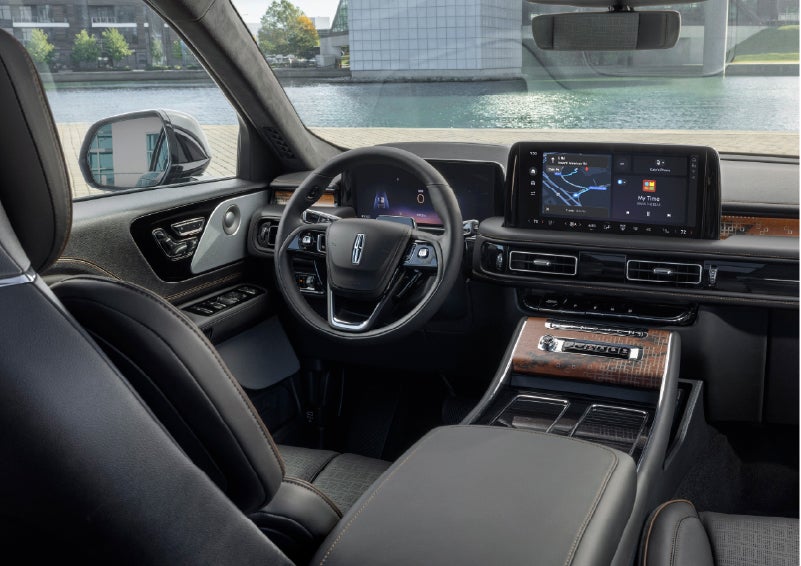 The interior of the 2026 Lincoln Aviator® SUV is shown parked with a view of a harbor through the windshield. | Thornhill Lincoln in Chapmanville WV