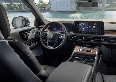The interior of the 2026 Lincoln Aviator® SUV is shown parked with a view of a harbor through the windshield. | Thornhill Lincoln in Chapmanville WV