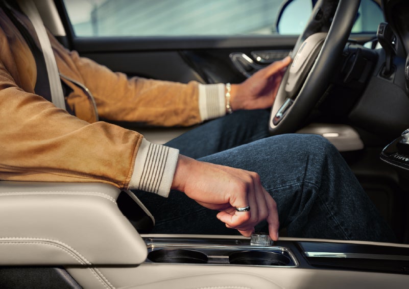 The driver of a 2026 Lincoln Corsair® SUV is shown selecting a drive mode. | Thornhill Lincoln in Chapmanville WV