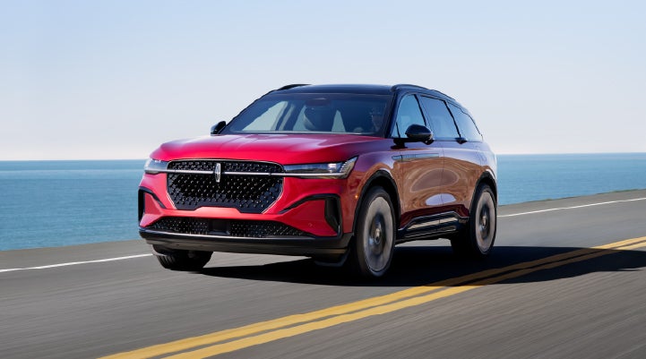 A 2026 Lincoln Nautilus® SUV is being driven on a seaside roadway. | Thornhill Lincoln in Chapmanville WV