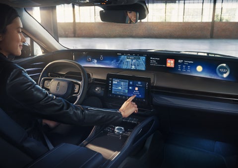 The driver of a 2026 Lincoln Nautilus® SUV interacts with the center touchscreen. | Thornhill Lincoln in Chapmanville WV