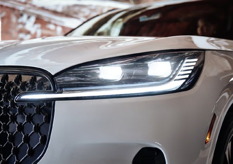 A close-up of a headlamp on the 2027 Lincoln Aviator® SUV is shown. | Thornhill Lincoln in Chapmanville WV