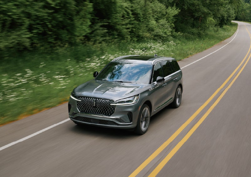 A 2027 Lincoln Aviator® SUV is being driven down a road. | Thornhill Lincoln in Chapmanville WV