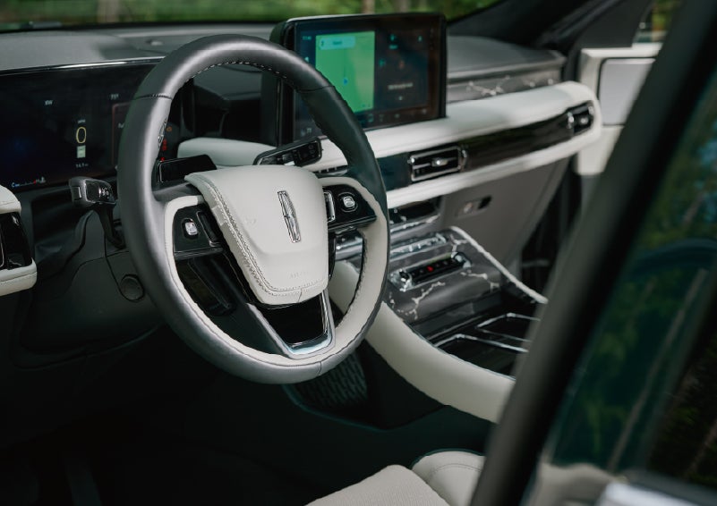 The leather-trimmed steering wheel of a 2027 Lincoln Aviator® Black Label™ SUV. | Thornhill Lincoln in Chapmanville WV