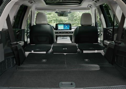 A rear to front view of the interior of a 2027 Lincoln Aviator® Black Label™ SUV shows the third and second rows folded flat | Thornhill Lincoln in Chapmanville WV