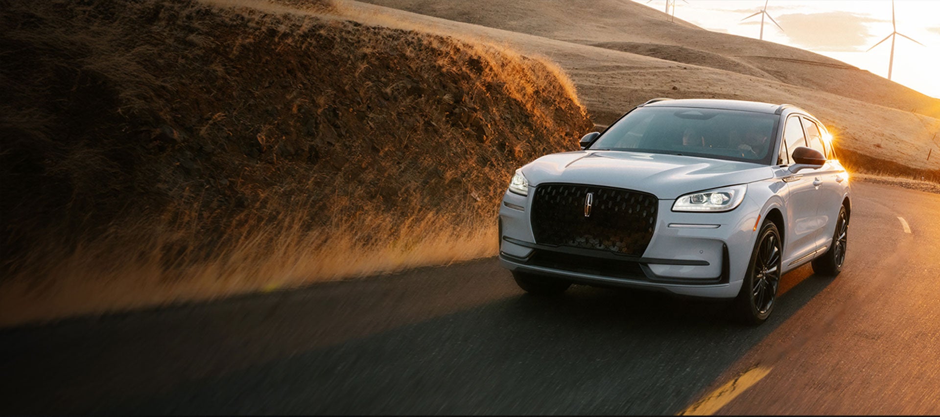 The Lincoln Corsair® SUV driving down a curvy road.